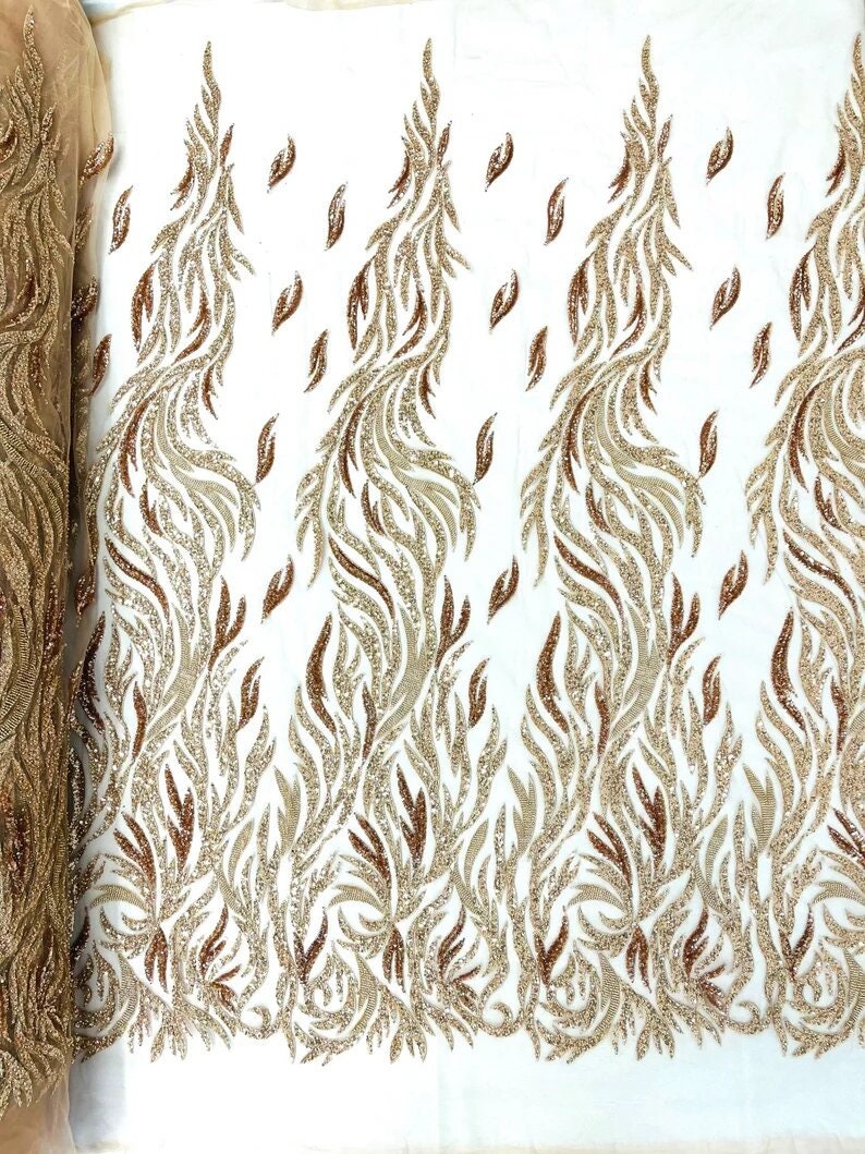 Fire Feather Designs embroider with sequins and heavy beaded on a mesh lace fabric-sold by the yard-