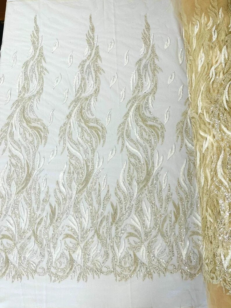 Fire Feather Designs embroider with sequins and heavy beaded on a mesh lace fabric-sold by the yard-