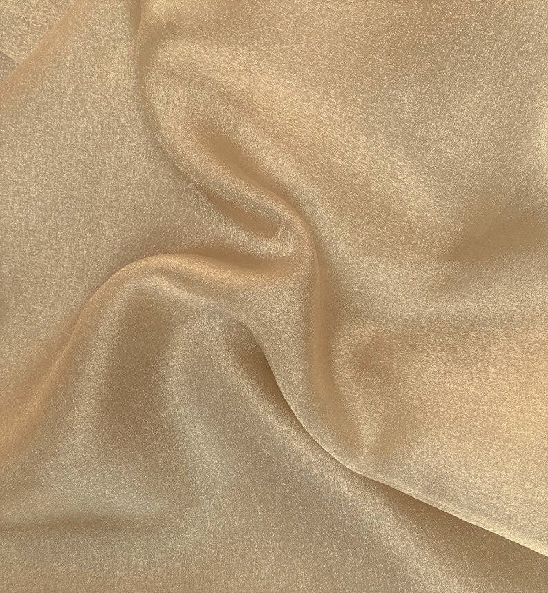 Polyester Soft Light Weight, Sheer, See Through Crystal Organza Fabric Sold By The Yard. Champagne