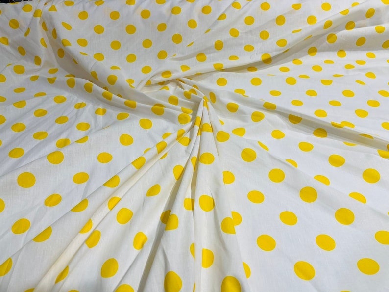 Premium 1 inch Polka Dot Poly Cotton Fabric Sold By The Yard. Yellow on White