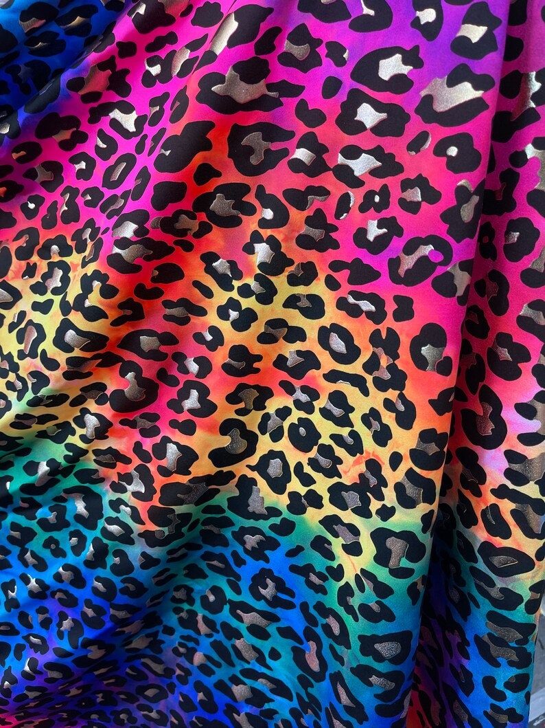 Black/Gold 4 Way Stretch Leopard Animal Print on Tie dye Rainbow Nylon Spandex Fabric Sold By Yard.