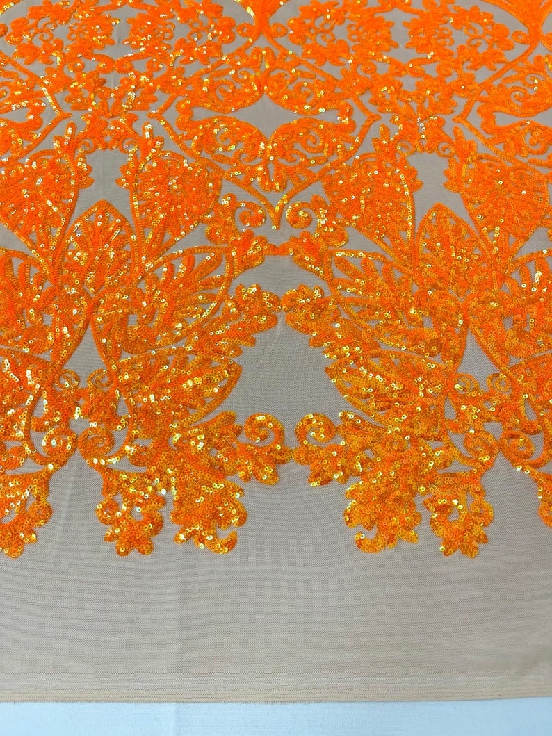 4 Way Stretch Fashion Design with Sequins Embroider on a 4 Way Stretch Mesh Fabric-Sold by The Yard. Neon Orange/Nude